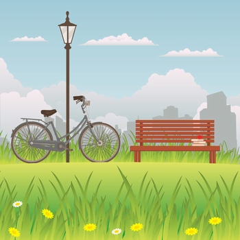 公园里的长凳旁边停着一辆自行车