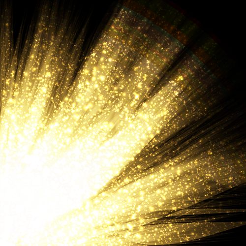 放射闪耀光芒金色粒子矢量背景图片