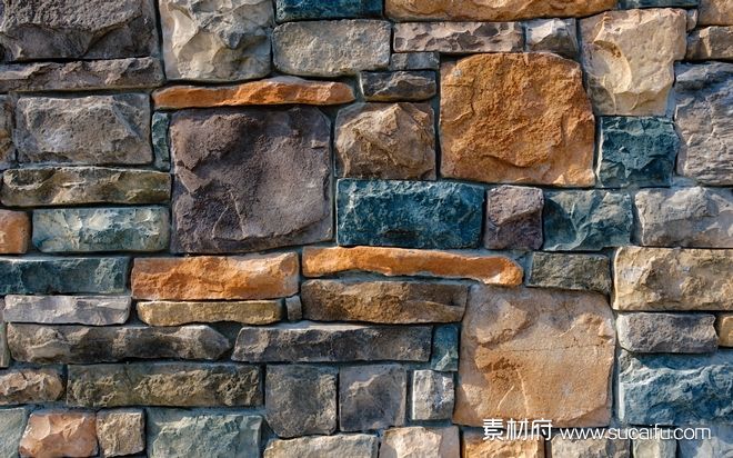 颜色漂亮的岩石砌成的砖墙背景